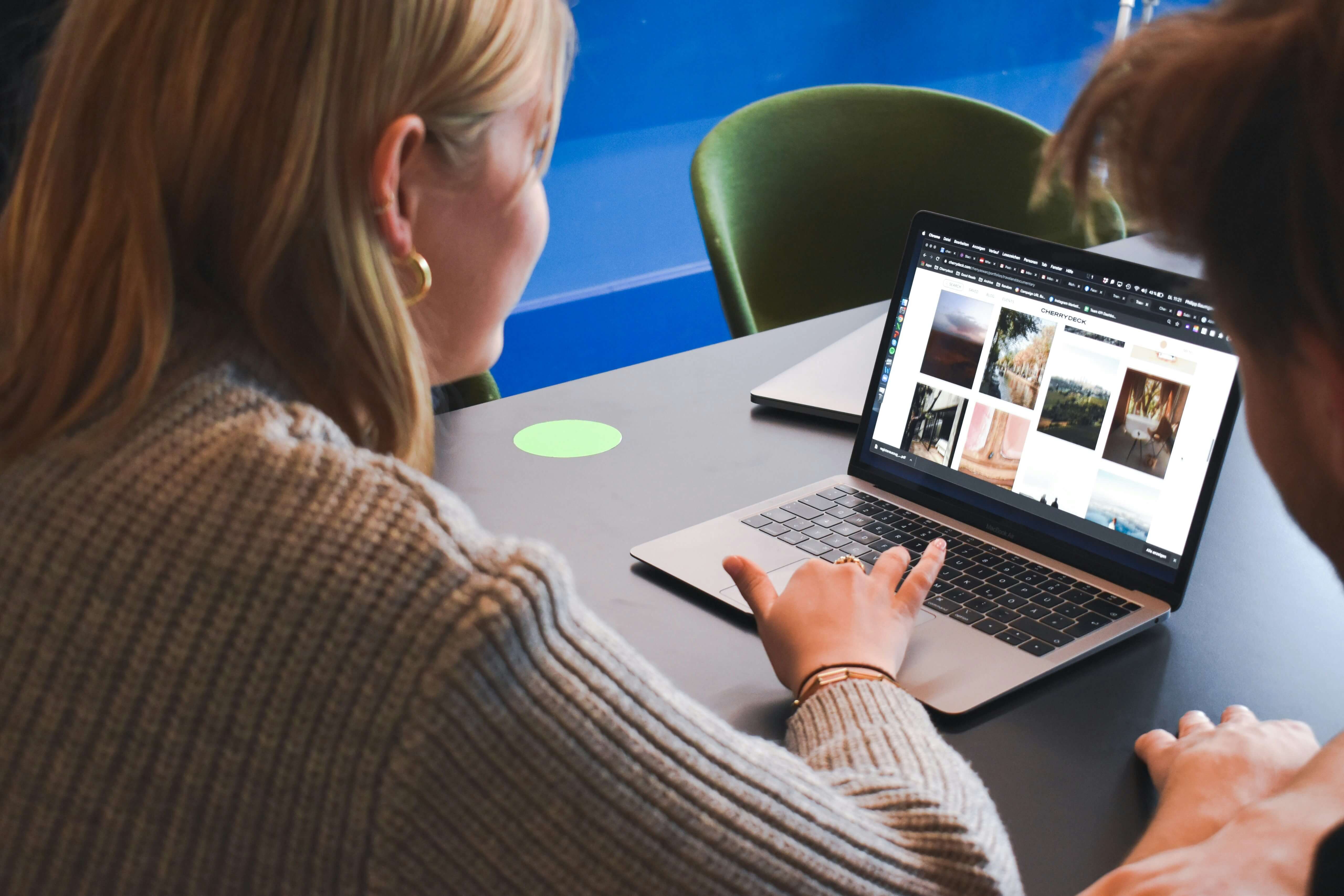 Small business owner reviewing their new professional website on a laptop